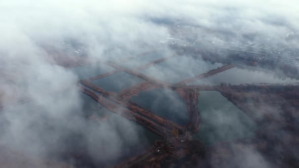 Aerial Drone View Flight Over White Clouds of Mist Artificially Created Lakes