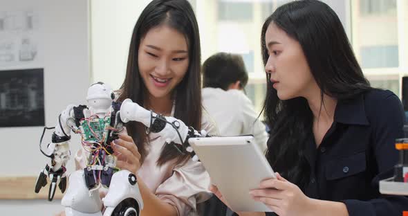 Young girl collaborating development robot