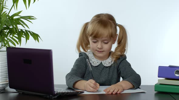 Preschool Child Girl Distance Online Learning at Home. Kid Studying Using Digital Laptop Computer