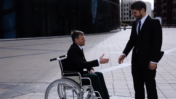 Happy Entrepreneur Shaking Hands With Disabled Employee