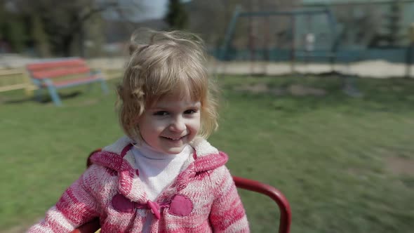 Funny Cute Girl Is Playing. Joyous Female Child Having Fun on Playground