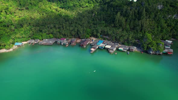 Aerial shot of local fisherman village beside the sea