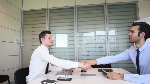 slow motion two young businessman doing job interview