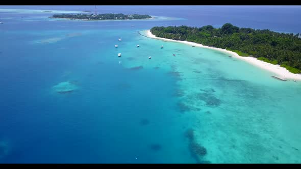 Aerial drone shot abstract of beautiful resort beach journey by blue ocean with white sandy backgrou