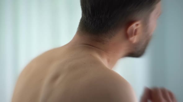 Man Feels Neck Pain After Woke Up in Morning, Uncomfortable Matrass, Closeup