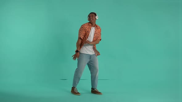 Young Man in Headphones Having Fun During Dance