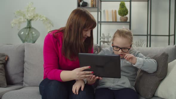Caring Mom with Special Needs Kid Making Video Call