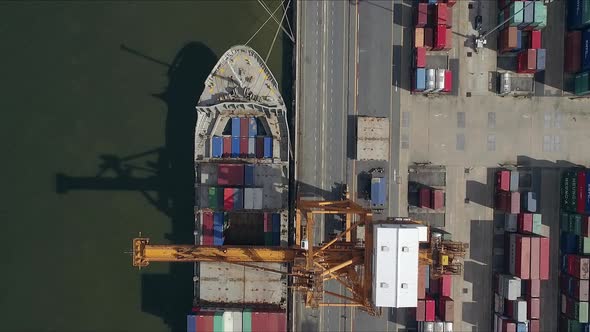 Logistic concept aerial shot of commercial maritime transport dockyard with cargo ships waiting to b