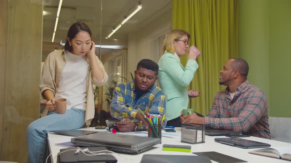 Diverse Business Partners Relaxing at Office