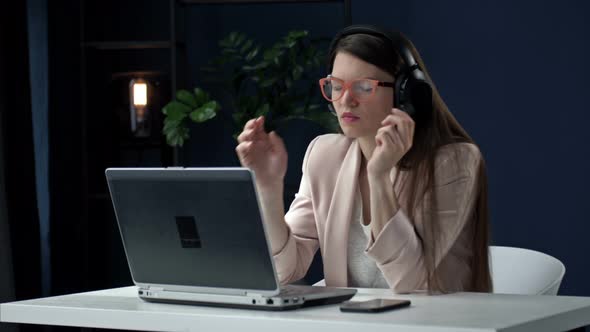 Business Woman Works Late at Night in the Office