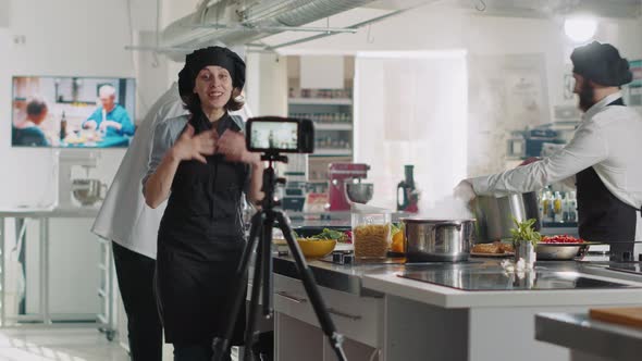 Female Chef Recording Cooking Show Video on TV Program
