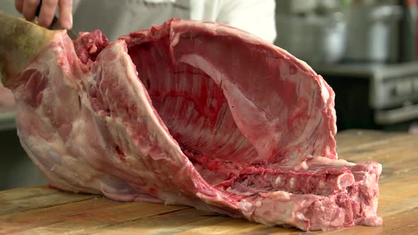 Butcher Carving Pork Carcasses