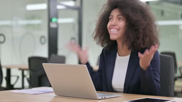 Young African Businesswoman with Laptop Shouting Screaming