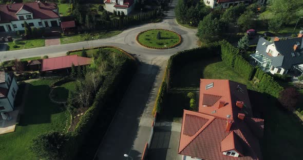 Aerial view of a housing estate, camera moving upwards.