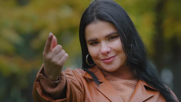 Closeup Young Seductive Friendly Hispanic Woman Standing Outdoors Looking at Camera Smiling Flirting