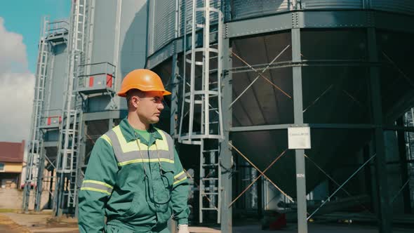 Engineer Inspecting Grain Storage Elevators