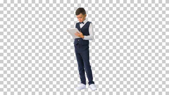 Concentrated boy using digital tablet while standing, Alpha Channel