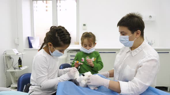 Two girls playing dentist