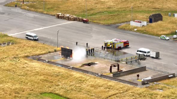 Firefighters Undergoing Training in a Mock Fire Response Emergency