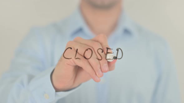 Closed, Man Writing on Transparent Screen