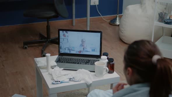 Close Up of Ill Patient Using Video Call for Telemedicine