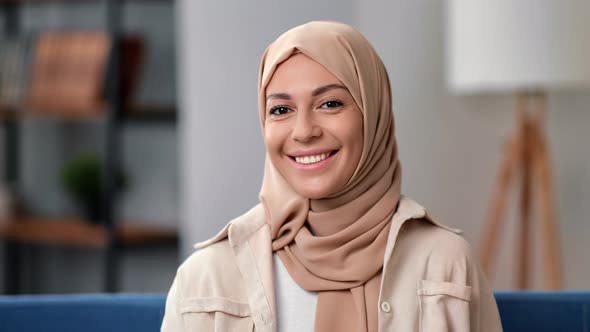 Portrait Cute Young Muslim Woman in Hijab Headscarf Smiling with Positive Emotion Posing at Home