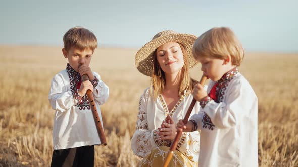 Boys Playing on Wooden Flutes  Sopilka