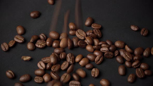 Closeup of Mocha Coffee Beans Fall and Bounce on the Table
