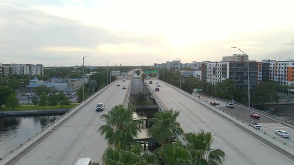 Cars driving on Highway bridge over riverwalk in Tampa, florida