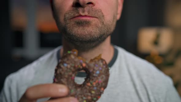 Man Hastily Eating Sweet Chocolate Donut