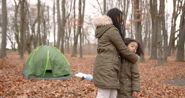 Black Race Sisters Having Fun in Autumn Forest