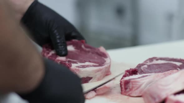 a butcher cutting meat