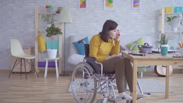 Young Woman with Disabilities in a Wheelchair Doing Make Up