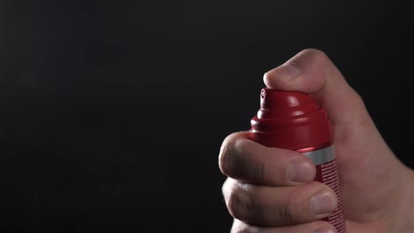 Closeup View of Human Hand and Spray Bottle Isolated on Black Parfume Moscito Spray Insects