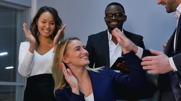 Group of business people giving an applause in the meeting