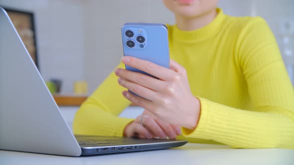 Young female using modern mobile phone for communication online in 4k footage