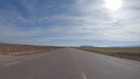 Car drivng in a country road in Spain