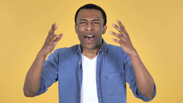 Young African Man Gesturing Failure and Problems Yellow Background