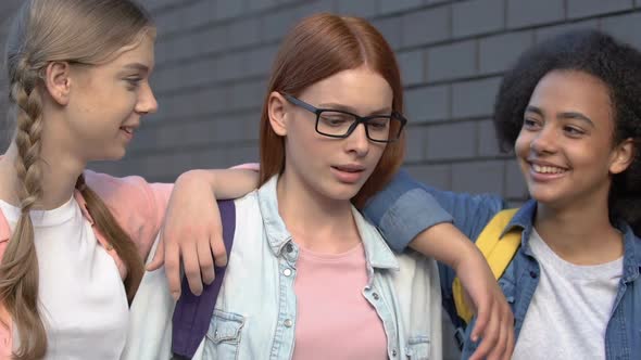 Schoolgirls Pushing Shoulders of Smart Female Student, Mocking Nerd in Glasses