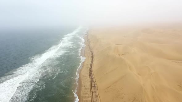 fly-over of the beach on the edge of the Namib desert in Namibia