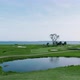 Flyover over of a bayside golf course - VideoHive Item for Sale