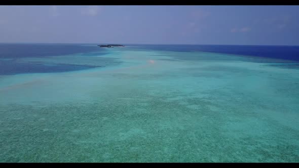 Aerial drone sky of tropical tourist beach break by shallow ocean with clean sand background of a da