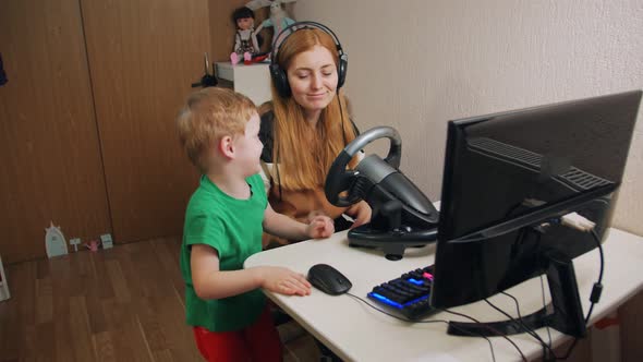 Exciting Boy And Woman Playing Racing