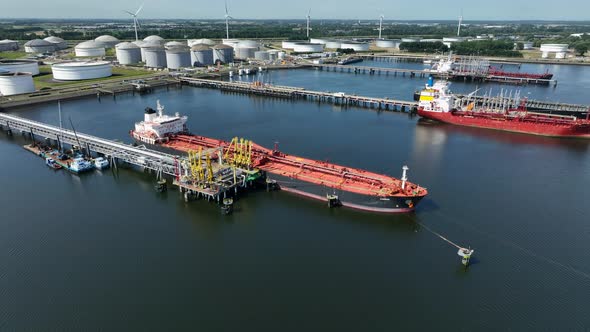 Liquid Cargo Transporter Ship Unloading Crude Oil to a Fuel Depot