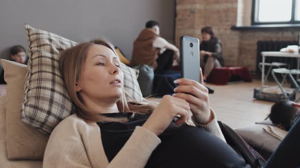 Pregnant Woman Video Calling in Shelter