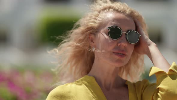 Pretty Middle Aged Woman with Fashion Sunglasses in Summer Portrait Shot