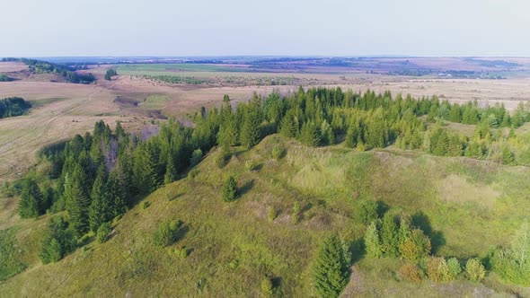 Aerial Flight over Fields and Hills - Drone Footage