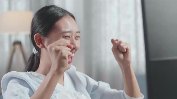 Close Up Of Asian Woman Engineer With The House Model Celebrating While Working On A Desktop