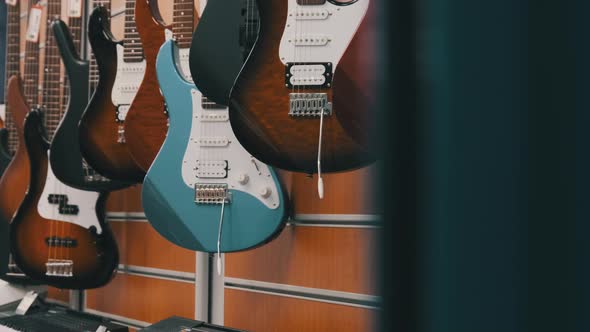 Many New Different Multicolored Electric Guitars are Sold in the Store