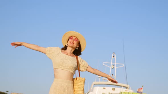 Happy girl with ship mast on sky background, slow motion